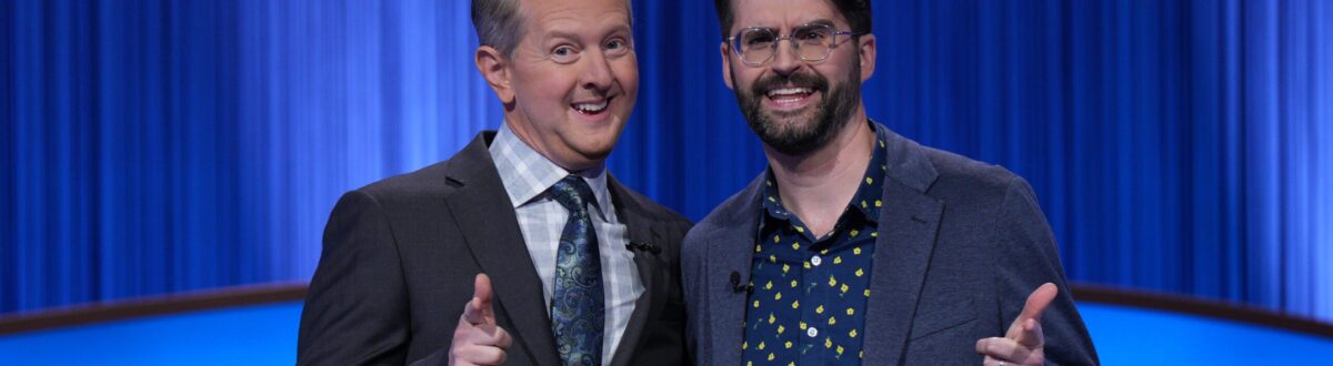 Peter Johnston posed with the host of Jeopardy! on the stage of the show.