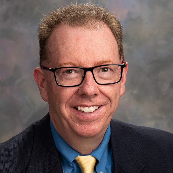 Professional headshot of Douglas Freed.