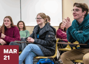 Students at Alma College listening to a lecture at their desks.