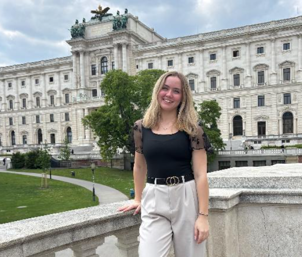 An Alma College student stands in front of a historical monument on her Spring Term course.