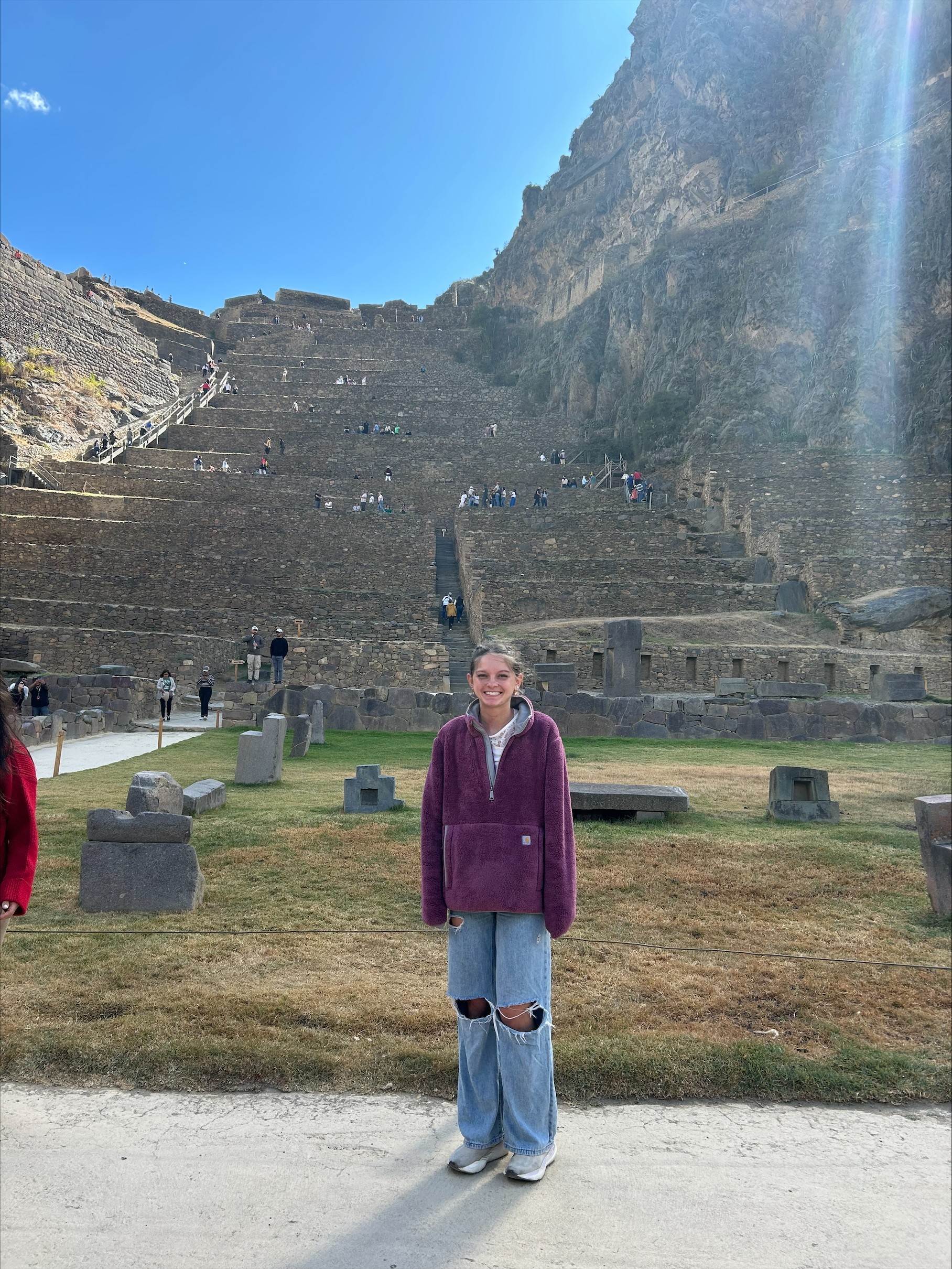 An Alma College student stands in front of a picture-esque landscape during her Spring Term.