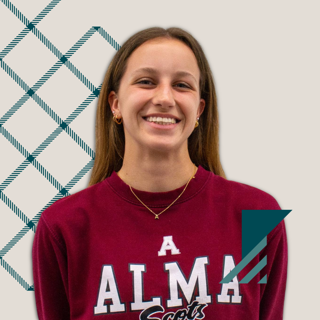 A young woman with long brown hair smiles while wearing a maroon Alma Scots sweatshirt. The light background features a geometric pattern and teal accent shapes—perfect for those looking to connect with your admissions office.