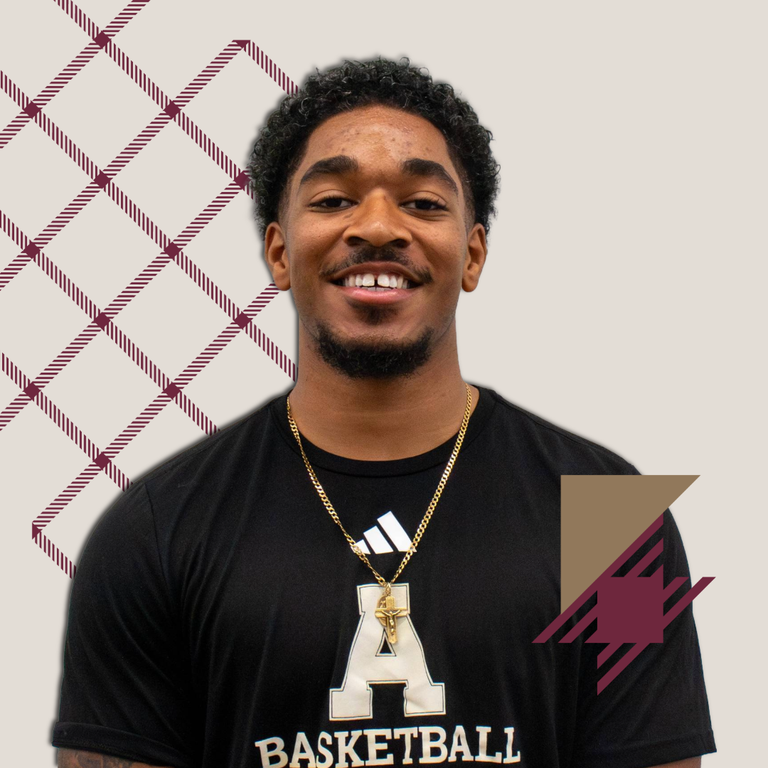 A young man with short curly hair, wearing a black A BASKETBALL shirt and gold chain, smiles at the camera. The maroon geometric background and graphic design highlight how you can connect with your admissions journey.