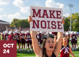 A cheerleader holds up a large sign reading MAKE NOISE at a football game, encouraging fans to connect-and-visit. Other cheerleaders and football players in maroon uniforms are on the field, with OCT 24 displayed in a red box in the corner.